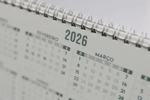 Close-up of a desk calendar marking the days